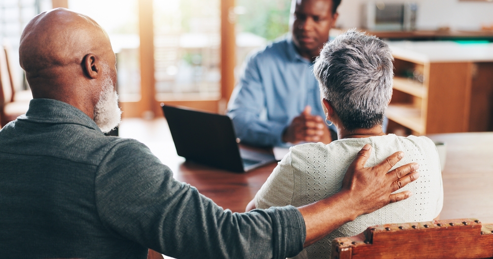 Meeting, debt and consulting with old couple with financial advisor for retirement fund, fraud protection and pension planning. Documents and solution with people at home for account manager